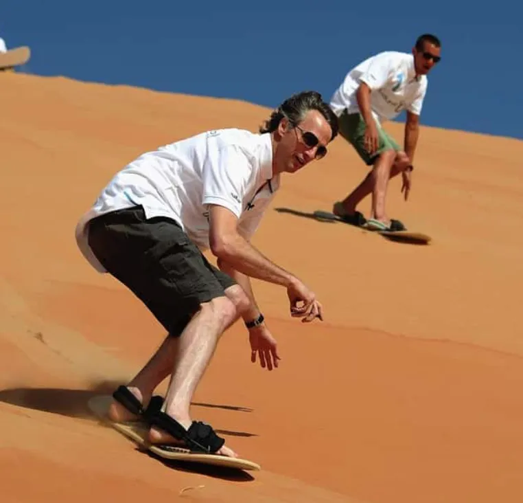 Sandboarding in Timlalin canyon (Timlaline canyons) dunes near Agadir