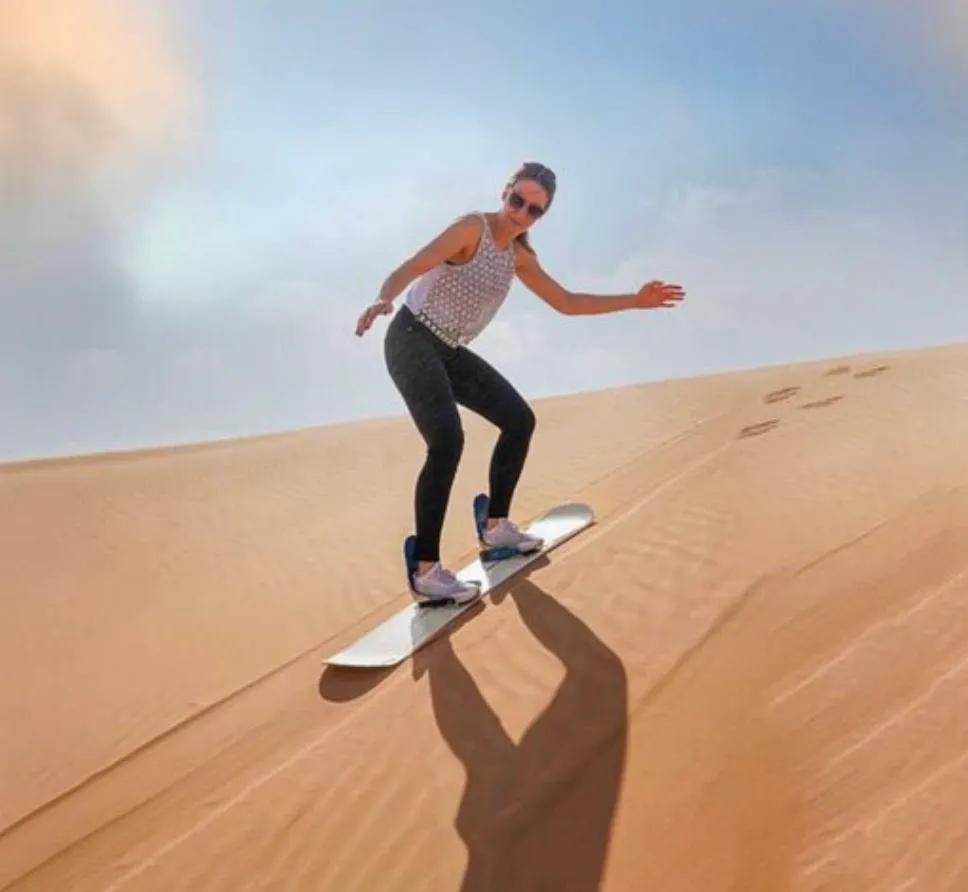 Sandboarding in Timlalin canyon (Timlaline canyons) dunes near Agadir