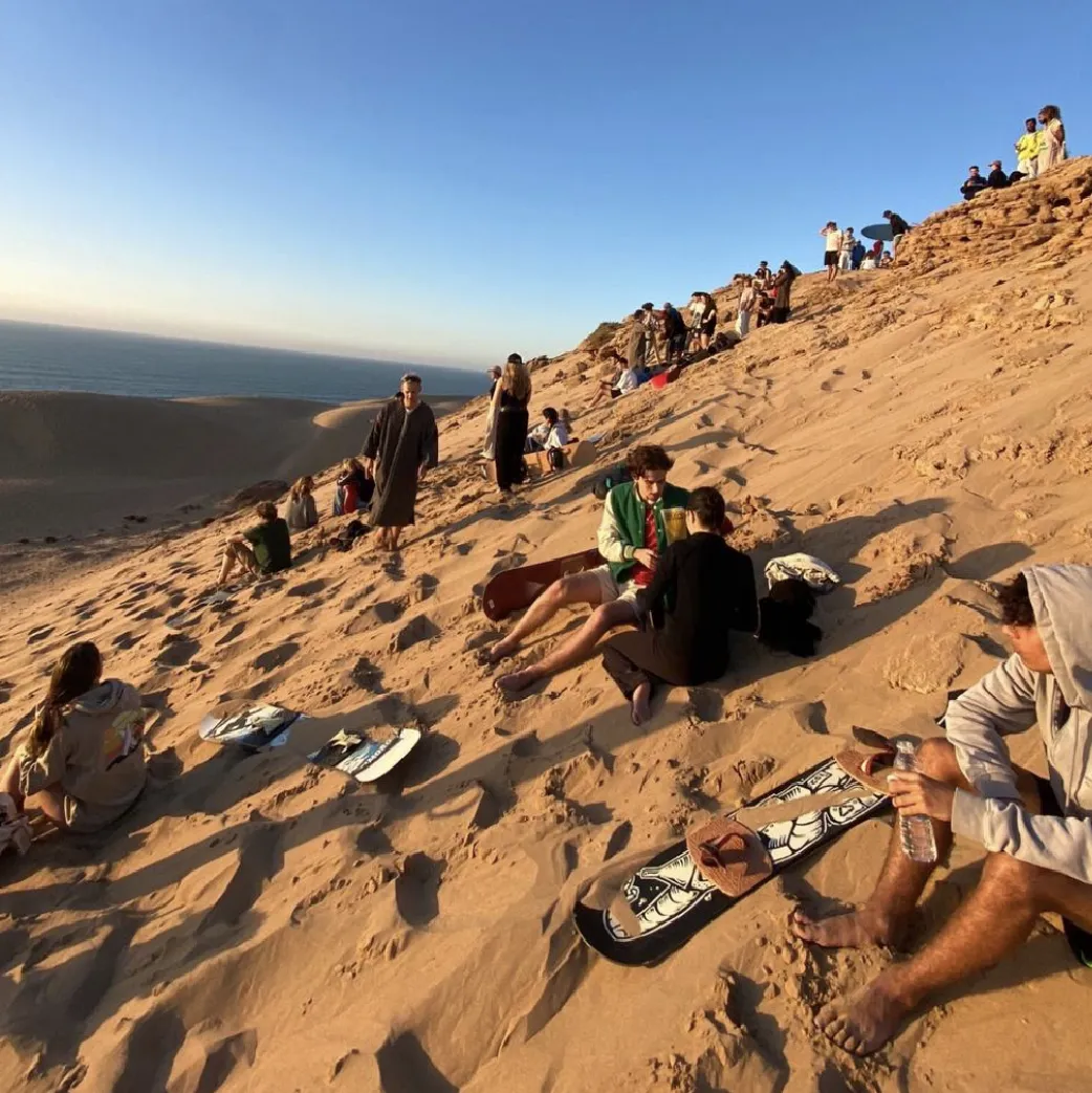 Sandboarding in Timlalin canyon (Timlaline canyons) dunes near Agadir